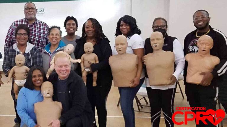 Group CPR training session in Orlando with mannequins for certification.